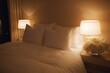 © Sanchai - A comfortable guest room with soft lighting, a neatly made bed, and fresh flowers on the nightstand