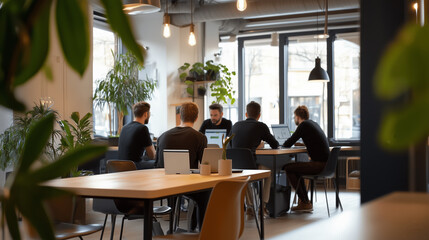 Poster - group of professionals collaborating in a modern workspace surrounded by greenery