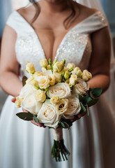 Wall Mural - Elegant Bride Holding a Beautiful Floral Bouquet