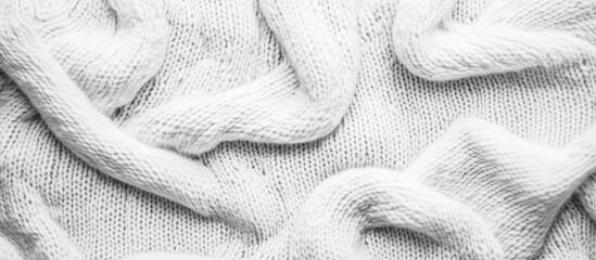 Poster - Close-up of cozy white knitted sweater texture showcasing intricate patterns and soft fibers for fashion and home dÃ©cor use