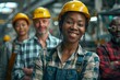 © S photographer - Smiling workers in safety gear representing teamwork and dedication in a modern industrial environment.