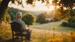 © imagineRbc - An older man sits quietly on a wooden bench, reflecting on life as the sun sets behind lush hills. Surrounding wildflowers add to the serene atmosphere