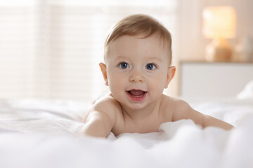 Wall Mural - Cute baby lying on bed at home