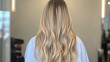 © Business Image - Balayage technique demonstration on long hair for spring hairstyle inspiration