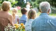 © Business Image - Serene graveside memorial service in a spring garden setting