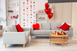 © Pixel-Shot - Blurred view of living room decorated for Valentine's Day with sofas, hearts and balloons