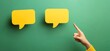 © LELISAT - Hand pointing at speech bubbles on green background for communication concept