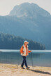 © EdNurg - Young hiker walking near Black Lake and Durmitor mountains in Montenegro