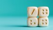 © Yulia - Stacked dice displaying mathematical symbols against light blue background