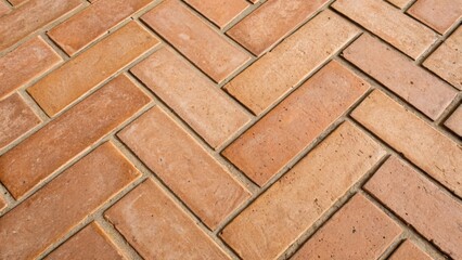 Poster - An upclose look at the intersection of two herringbone tiles revealing the precise angles and the subtle variations in the terracotta textures.
