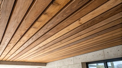 Aufkleber - A detailed image focusing on the rough edges of the slats where they meet the ceiling illustrating the transition from raw wood to the finished feature wall.