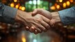 © Indri - Two hands clasped in a firm handshake agreement