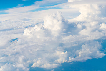 Wall Mural - Blue sky with clouds in the sky. Beautiful blue sky background with clouds.Natural and cloudy fresh blue sky background. White fluffy clouds in the blue sky.