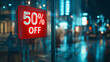 © Cozy Art - Red 50% off discount sign in a shopping mall at night