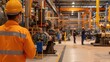 © Gams Images & Videos - Industrial scene with workers in safety gear operating machinery in a factory setting.
