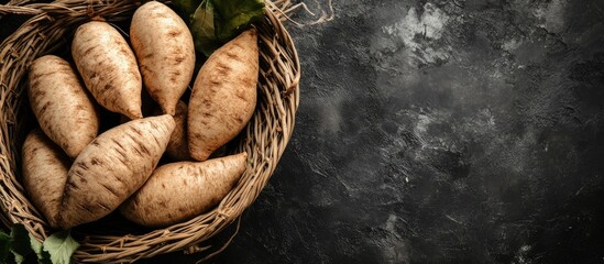 Poster - Freshly Harvested Yacon Root in Baskets on Dark Background with Space for Text or Design Elements