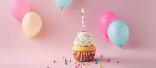 Wall Mural - Birthday cupcake with pastel balloons and sprinkles.