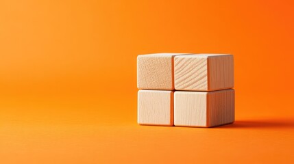 Fototapete - Turned wooden cubes on vibrant orange background representing business exchange and creativity with ample copy space for text