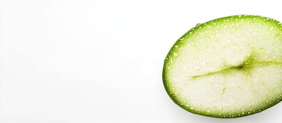 Poster - Green apple slice on clean white background with ample empty space for text or design elements for fresh and healthy content.