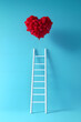 © john - White ladder reaching to heart shaped balloon against blue background