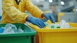 © Oktyabrskiii - Sorting plastic waste at a recycling facility during daylight hours to promote environmental sustainability