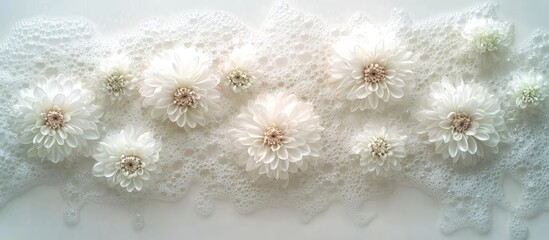 Poster - Elegant vertical display of fresh white chrysanthemum flowers on a delicate lace background for a serene and calming composition.