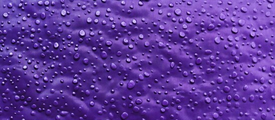 Poster - Purple textured backdrop with water droplets creating an artistic surface ideal for creative design and background applications