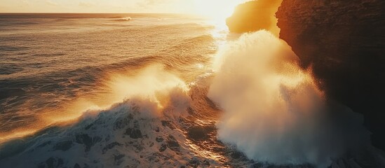 Aufkleber - Dramatic sunset view of ocean waves crashing against rugged coastline cliffs creating a serene and powerful seascape atmosphere