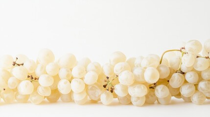 Aufkleber - White raisins arranged aesthetically on a clean white backdrop showcasing their translucent texture and natural sweetness.