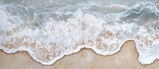 Aufkleber - Cascading white waves on a sandy beach creating a picturesque travel scene perfect for relaxation and vacation themes