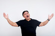 © Mdv Edwards - Man expressing strong emotions with hands raised on white studio background