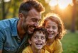 © Pete - Happy family enjoys sunny day in park. Father laughs with children. Kids smiling. Family bonding. Outdoor fun. Lovely moment. Summertime activities. Fun day out. Fatherhood. Family time.