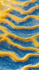 Poster - Abstract background featuring a wavy pattern of blue and gold granular material, creating a visually stimulating texture with contrasting colors