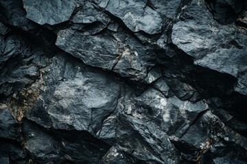 Poster - An image showcasing dark, rough stones with natural textures, highlighting the raw beauty and complexity found in rugged earthly elements and formations.
