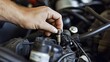 © Instrudify - Macro shot of a mechanic s hand adjusting a spark plug wire, engine details visible.
