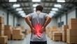 © Krasavina Alena - Man experiencing lower back pain in warehouse, red highlight effect