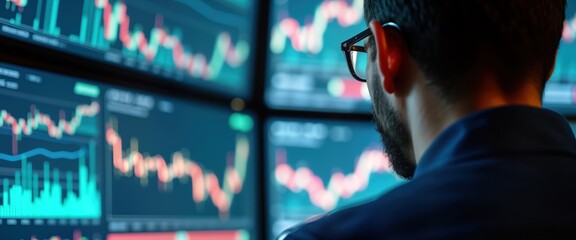 Aufkleber - Man in office analyses financial charts on multiple screens. Pro investor scrutinizes stock market data. Market analysis in progress. Monitors market trends on tech screens. Focus on portfolio