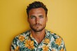 © Isuru - Serious young man with blue eyes on vacation.