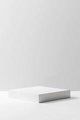 Poster - Minimalist White Box Positioned Elegantly on a Clean Surface Inviting Curiosity and Creativity in a Bright, Modern Space