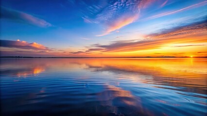 Wall Mural - Tranquil water surface with dynamic orange and blue hues at twilight, orange, blue, water, tranquil, surface, twilight