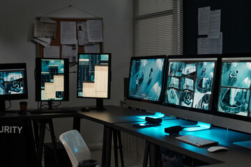 Poster - Row of desktop computer monitors with records of cctv video cameras on screens standing on workplaces of surveillance officers