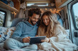 © Dzmitry - Cozy moments in a camper van with technology and connection