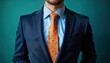 © miss irine - Man in a formal blue suit with an orange tie featuring flower patterns. Close-up view of the suit jacket shirt and tie. Business style clothing. Formal occasion. Professional attire.