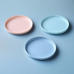 Poster - Three pastel-colored round plates on blue background.