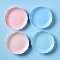 Poster - Four pastel-colored plates arranged in a square on a light blue background.