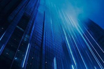Poster - A modern skyscraper with blue glass facade. Streaks of light extend from the building.