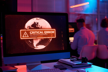 Aufkleber - Workplace of IT engineer in dark server room with computer screen showing critical error in working process