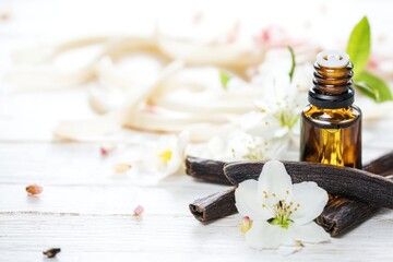 Poster - A close-up view of a bottle of essential oil sitting on a table, ready for use