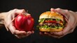 © Helga P-A. - A pair of hands holds a red apple in one hand and a cheeseburger in the other, showcasing a choice between healthy and unhealthy options.Concept of: Dietary choices