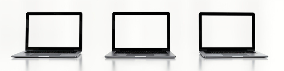 Poster - Three modern silver laptops stand on white surface. Blank screens showcase possibilities for digital content. Portable tech devices ready for various tasks. Clean minimalist design for modern